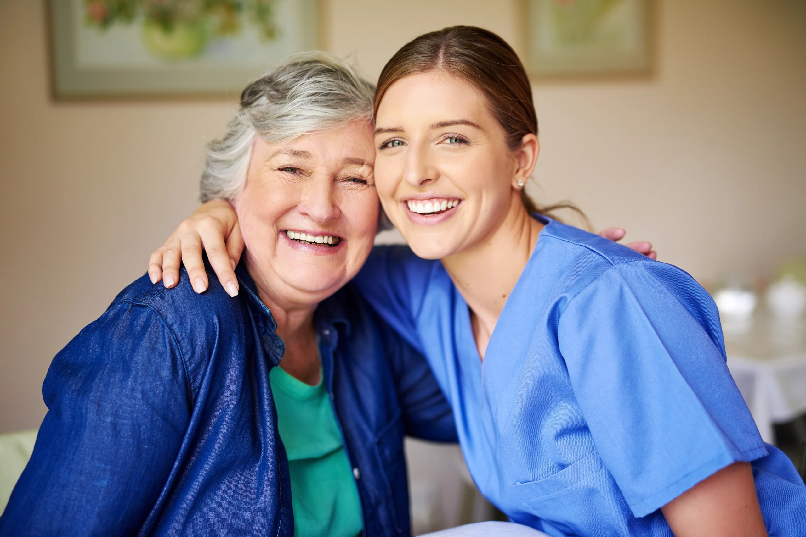 24-hour-home-care-in-Minneapolis-MN-2 young female caregiver shoudler to shoulder with smiling senior woman