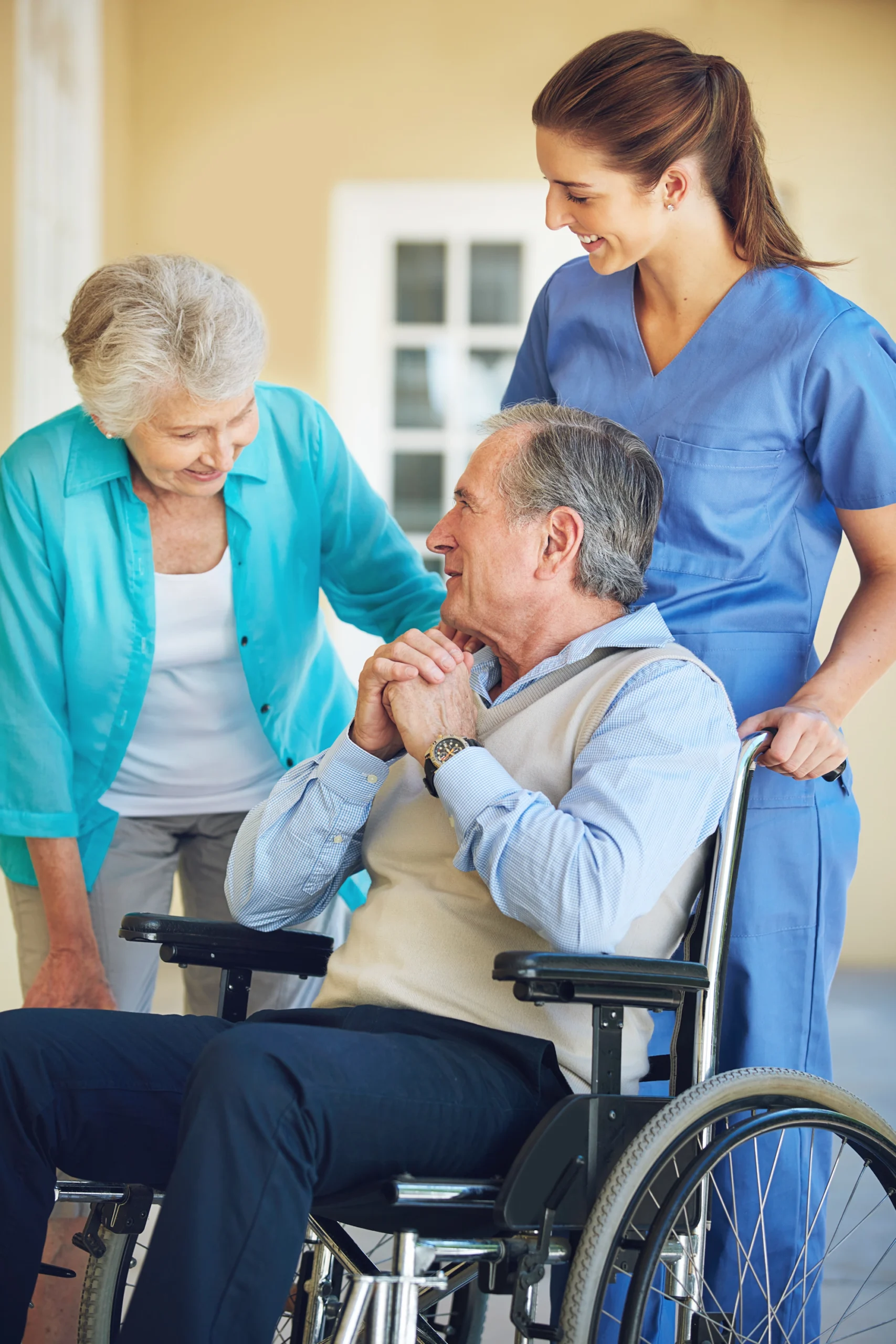 245D-Basic-Waivered-Services-in-Rush City-MN-3 elderly wife checks on her husband in weheelchair while caregiver oversees