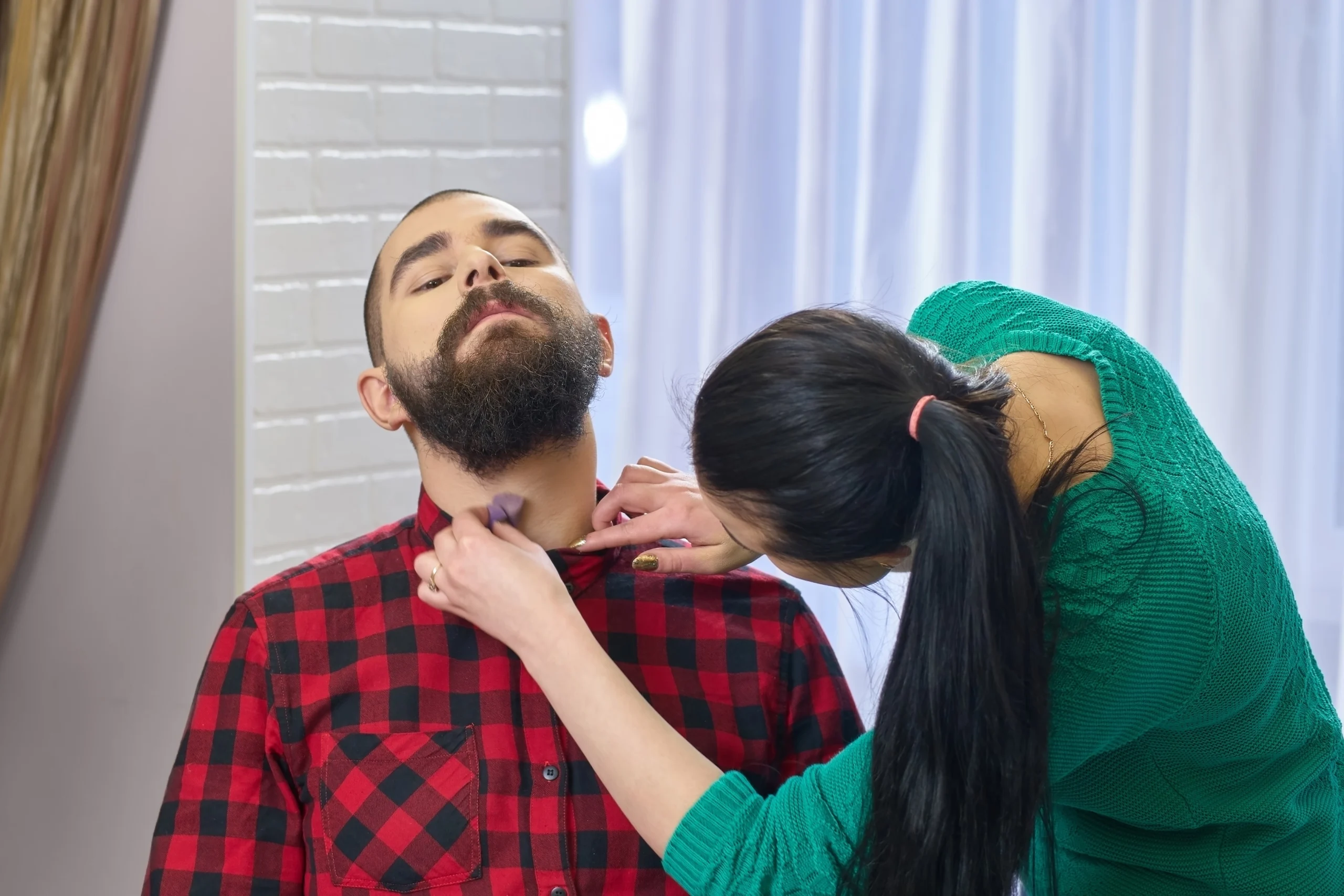 Tracheostomy-Home-Care-in-Rush-City-MN-2 asian caregiver checks the throat of a young man