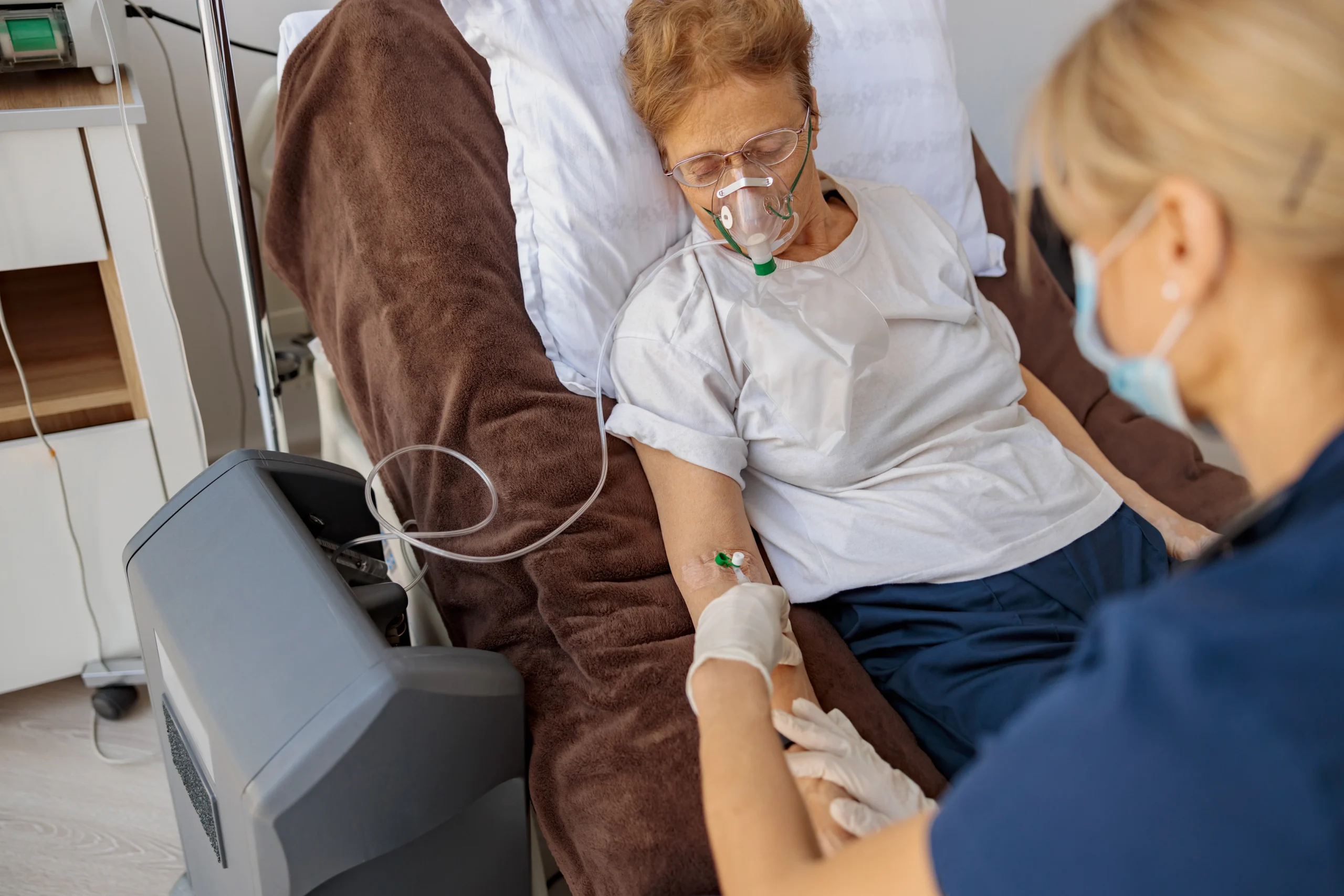 Ventilator-Home-Care-in-Rush-City-MN-2 nurse checking ventilator of elderly woman in her home