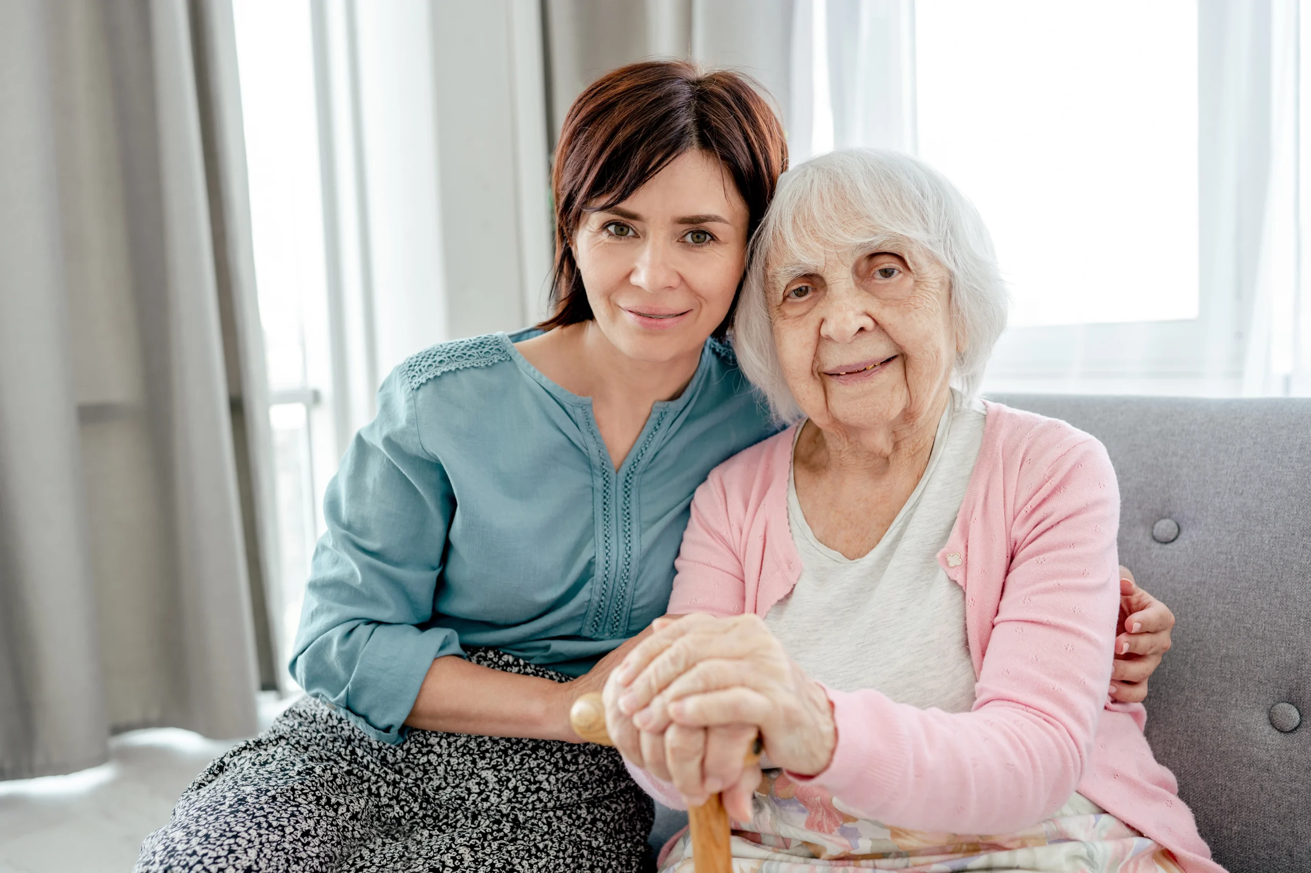 senior-home-care-in-Rush-City-MN-2 woman with brunette hair embraces senior woman