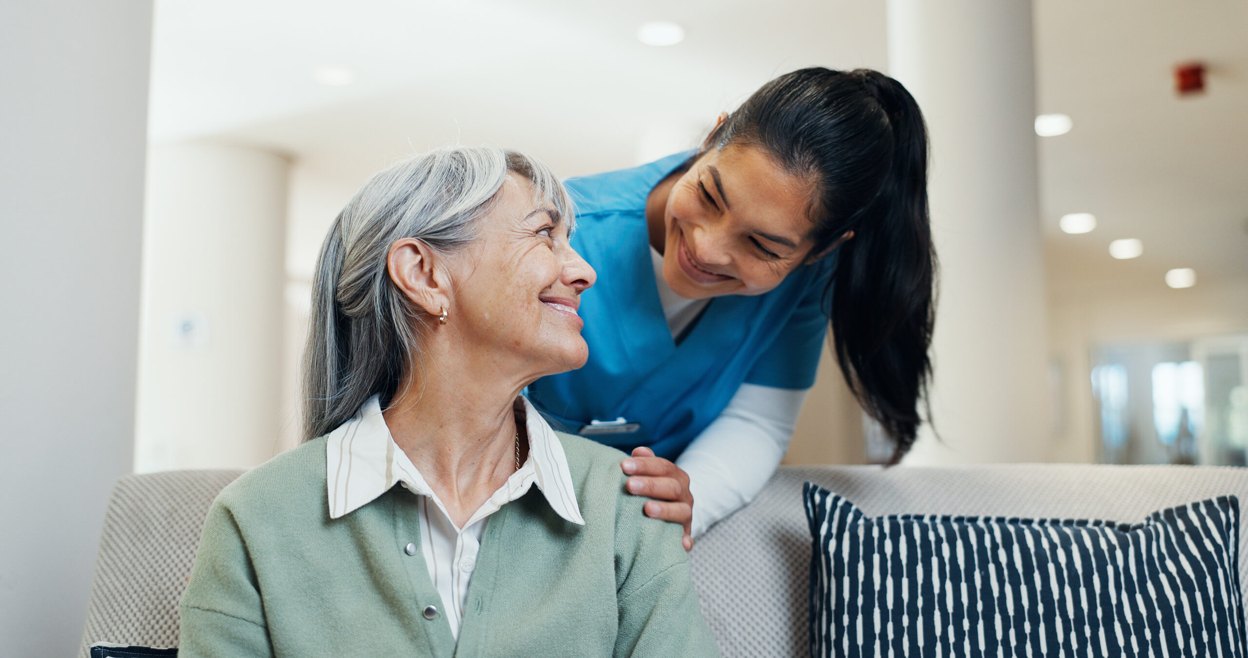 Companion Care Woodbury, MN caregiver providing friendly conversation, meal support, medication reminders, and companionship for a senior at home.